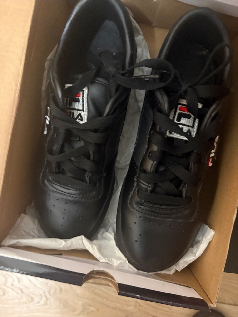 Fila Black Leather Low-Top Sneakers with Subtle Red & White Accents